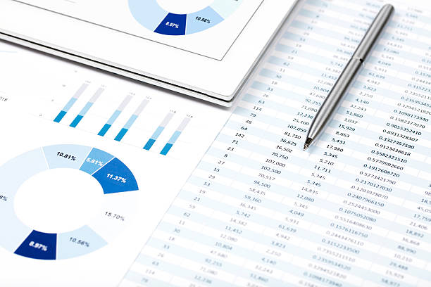 istock Business chart on the tablet pc and printed media 612845268