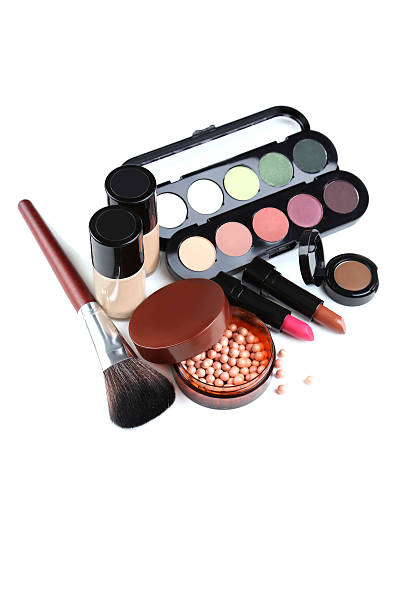 istock Makeup brush and cosmetics isolated on a white 612845364