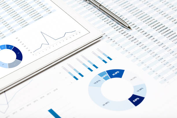 istock Pen and business reports on the desktop 612847600