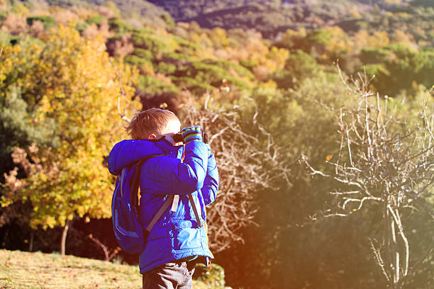 istock little explorer hiking in autumn mountains 612848136