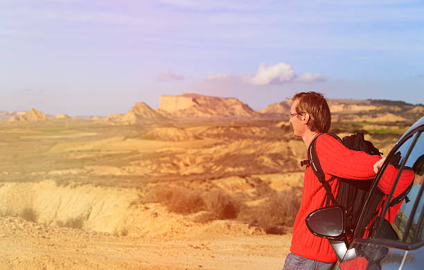 istock young man travel by car in mountains 612848936