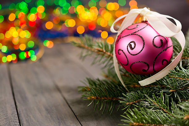 istock Christmas ball hanging on bokeh bright background. 612849890