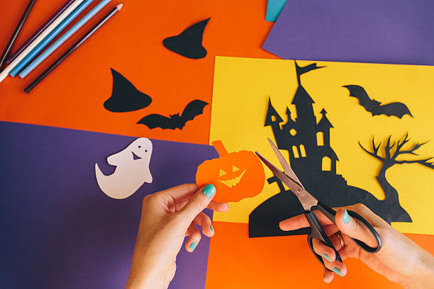 istock paper orange pumpkin on the background Halloween composition 612850906