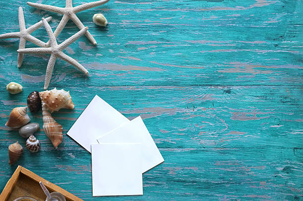 istock Fish star and sea shells on the blue wooden background 612851540