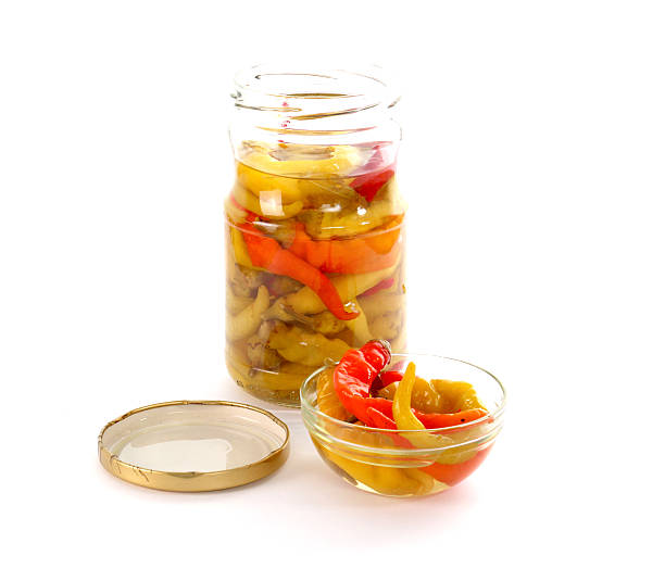 istock Isolated glass bowl with conserved chilli paprika 612851792