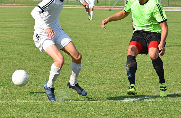 istock Playing soccer outdoors 612852828