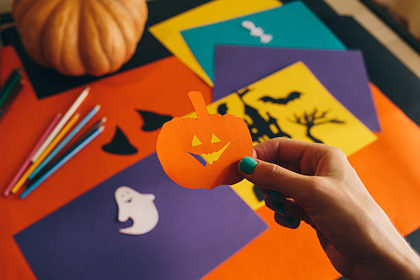 istock paper orange pumpkin on the background Halloween composition 612853446