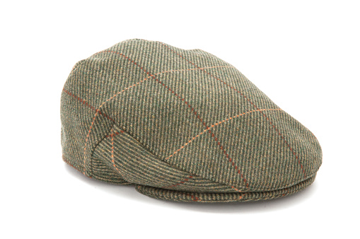 Cutout of a green tweed hunting hat or flat cap