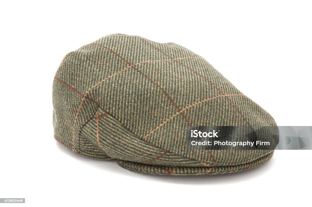 Green Tweed Hunting Flat Cap Cutout of a green tweed hunting hat or flat cap Flat Cap Stock Photo