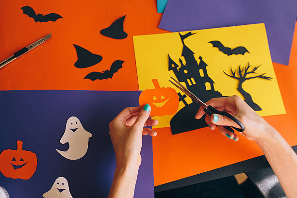 istock paper orange pumpkin on the background Halloween composition 612853644