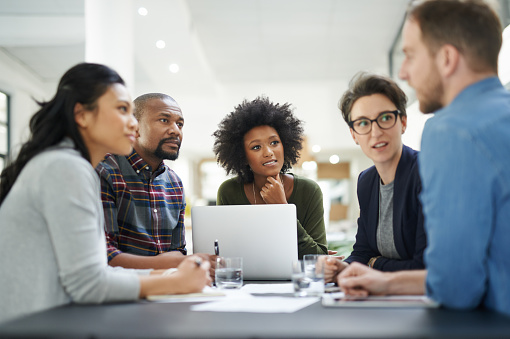 Shot of a team of colleagues having a meeting in a office