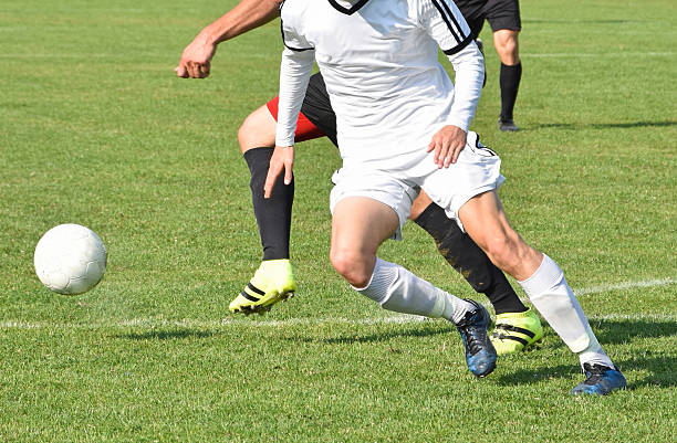 istock Playing soccer outdoors 612854192