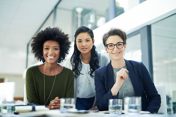 If it’s productivity you’re after, you’ve found the right team Portrait of a diverse group of colleagues having a meeting together in a modern office businesswomen group stock pictures, royalty-free photos & images
