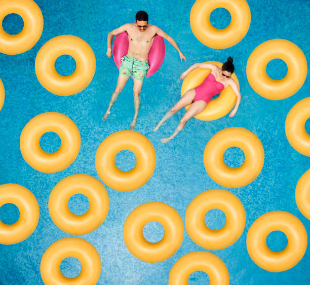 Couple relaxing at swimming pool