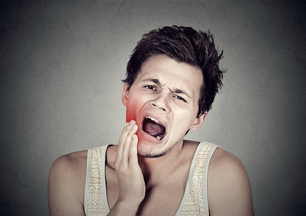 istock man with toothache tooth pain 612855328
