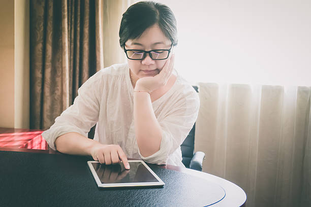 istock Businesswoman using digital tablet indoors 612855612
