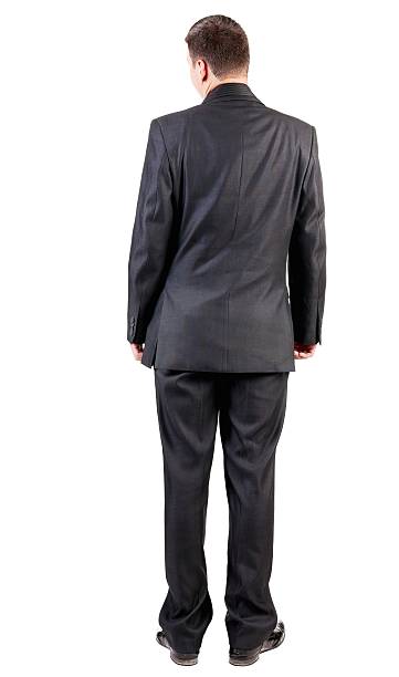 istock back view of business man in black suit  watching. 612856766
