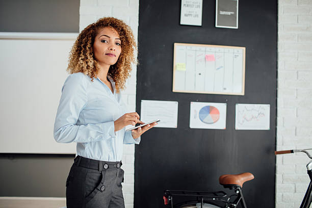 istock Latina Businesswoman Using Digital Tablet In Her Office. 612856826