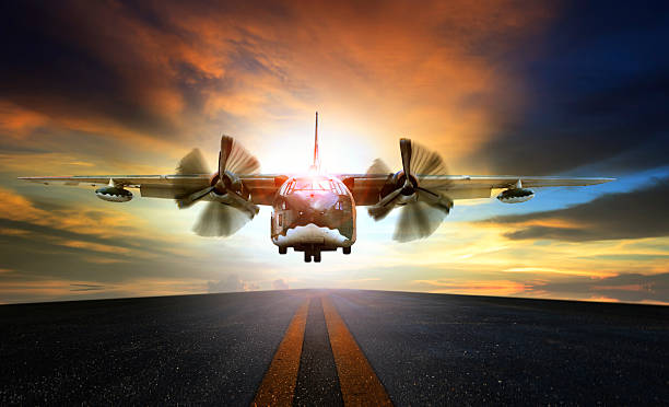 istock old military plane approaching to landing on airport runway 612857344