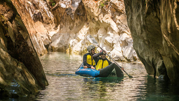istock Two men in  life jackets on a rafting 612859290