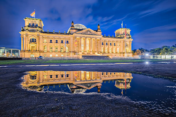 istock The Reichstag building at night in Berlin, Germany 612861882