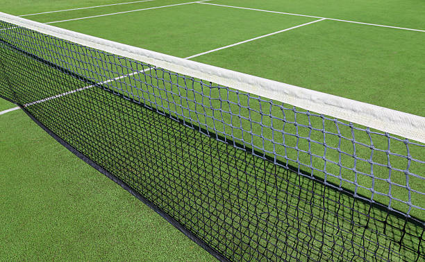 istock Tennis court with green artificial grass 612862166