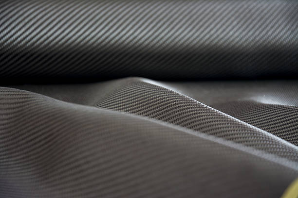 istock Carbon fiber composite raw material background 612862300
