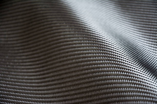 istock Carbon fiber composite raw material background 612862348