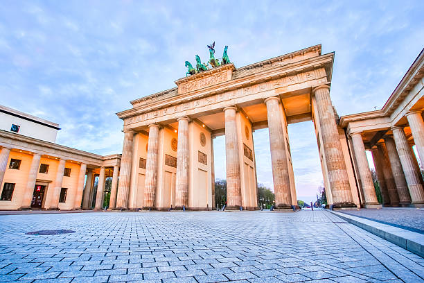 istock Sunrise at The Brandenburg Gate in Berlin, Germany 612862350