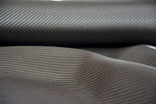 istock Carbon fiber composite raw material background 612862396