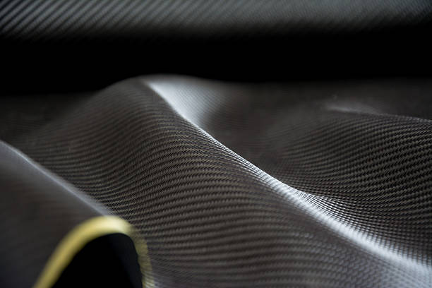 istock Carbon fiber composite raw material background 612863114