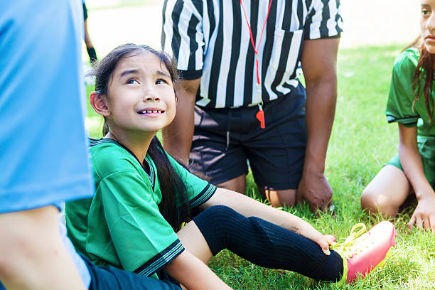 istock Injured soccer player holds ankle 612863988