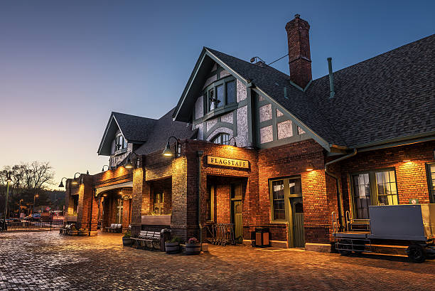 Flagstaff, Arizona, USA - May 16, 2016 : Historic train station in Flagstaff at sunset. It is located on Route 66 and is formerly known as Atchison, Topeka and Santa Fe Railway depot. 