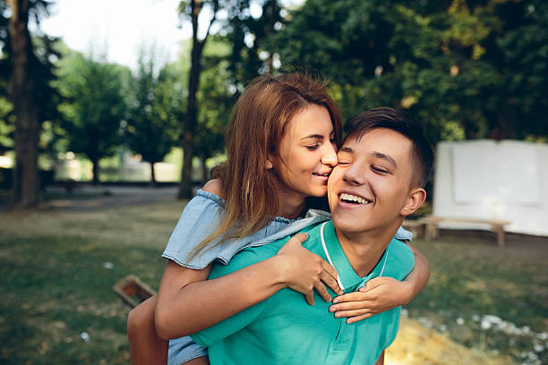 istock man carries a girl on his back 613013396