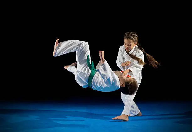 Children martial arts fighters isolated