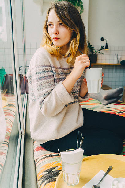 Woman drinking cacao in cafe