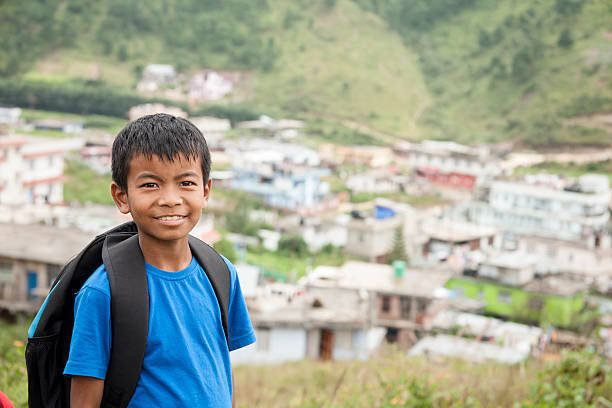 istock Happy, Asian descent boy outdoors in Indian city. 613014632