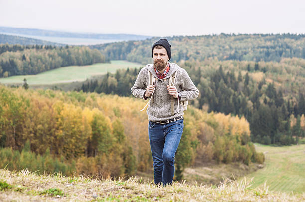 istock Young man walking on a hiking trail 613014676