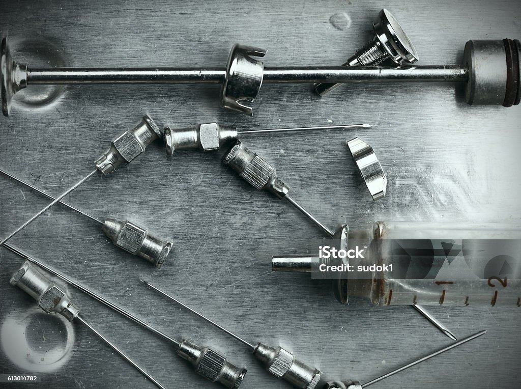 Obsolete glass syringe and needles Obsolete glass syringe and needles in the steel tray AIDS Stock Photo