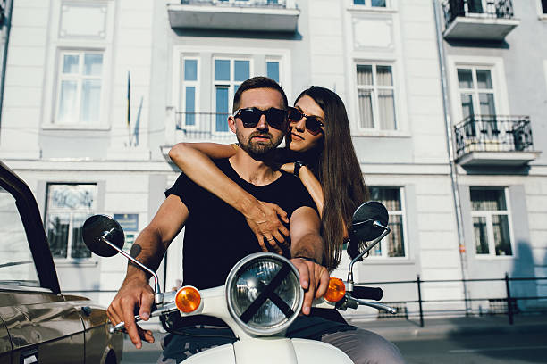 istock Cute couple with their scooter 613015944