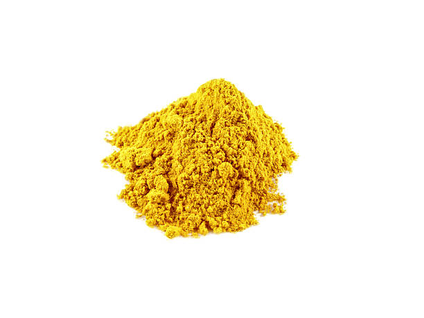 istock Yellow curry powder isolated on white background 613017170