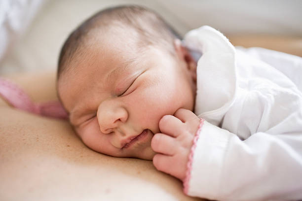 istock Newborn baby with mother 613017370