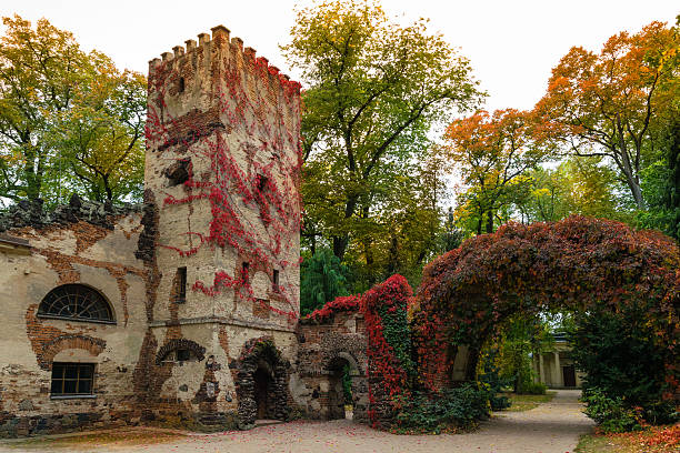 Arkadia, Poland - September 30, 2016: Burgrave's house and stone arch in the  sentimental and romantic Arkadia park,  near Nieborow, Central Poland, Mazovia. Garden in the English style