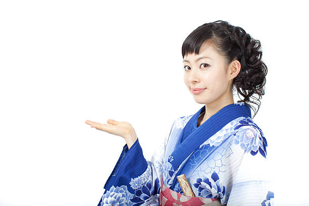 istock Japanese woman wearing yukata making gestures 613020676