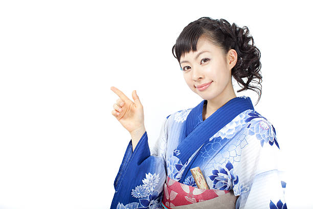 istock Japanese woman wearing yukata making gestures 613020704