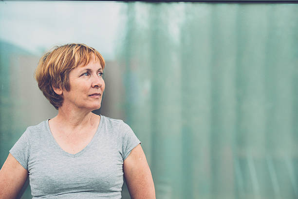 Independent Senior woman portrait - looking away, front view