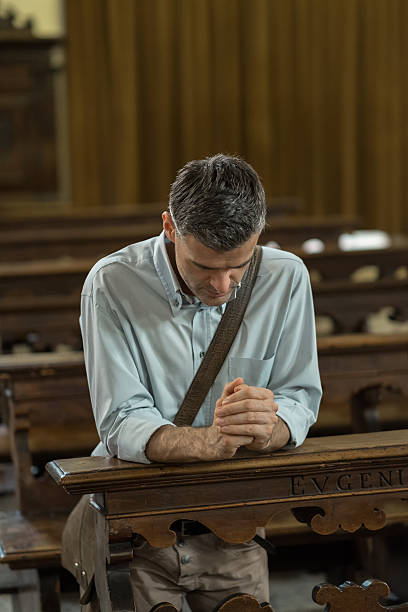 istock Religious man in the Church 613022028