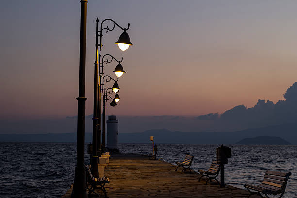 istock The Beach pier with lamps at sunrise 613023574