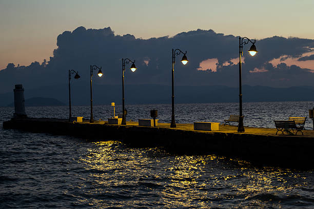 istock The Beach pier with lamps at sunrise 613023762