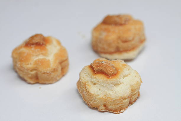 istock Cashew nut cookies on white background, selective focus. 613024116